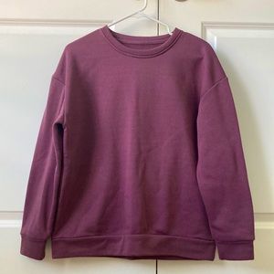 This is a women’s crew neck sweatshirt from Shein, it’s a dark purple.